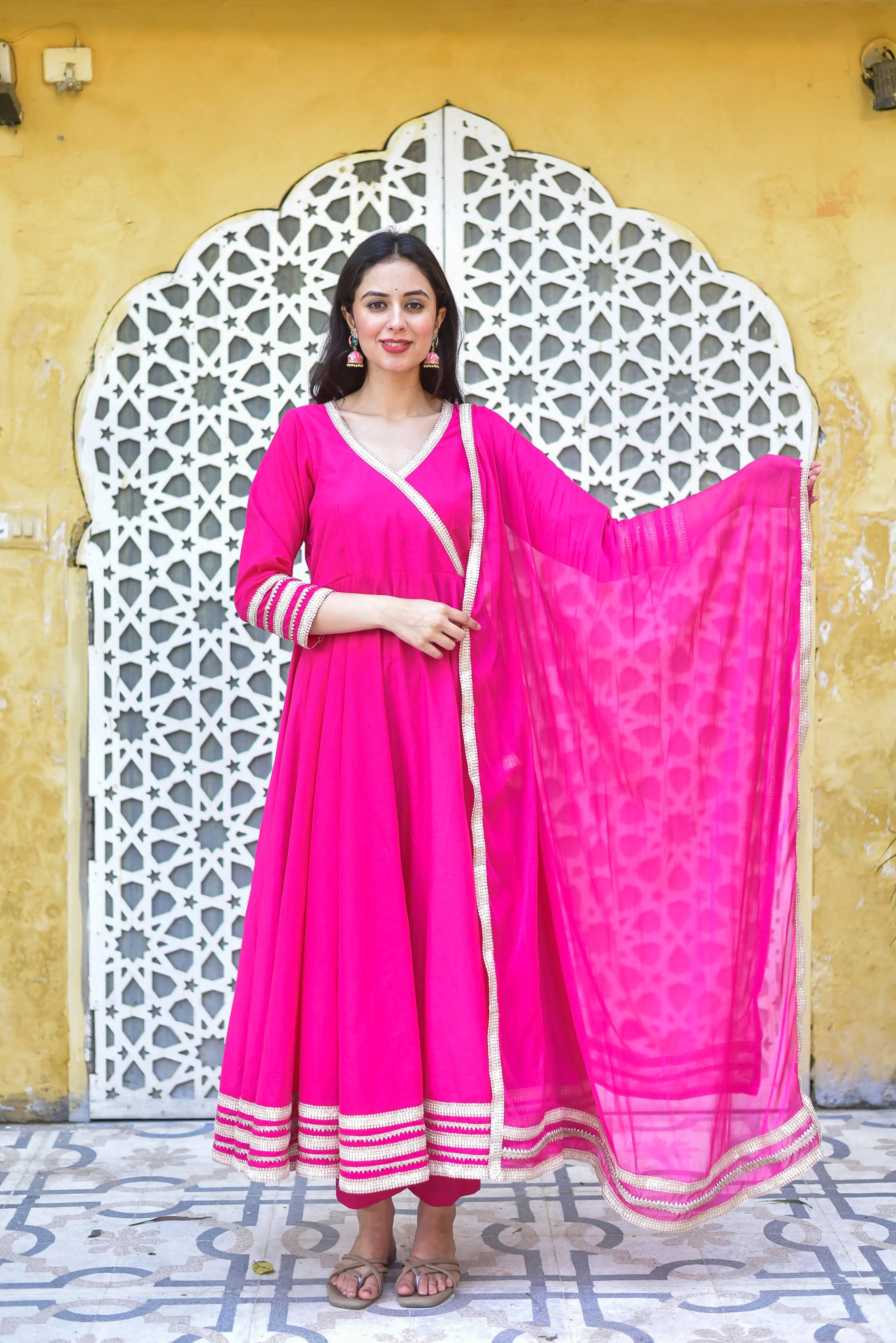 The Vibrant Rani Pink Anarkali Set: A Timeless Fusion of Elegance and Festive Spirit

This captivating rani pink anarkali set is a vibrant expression of elegance and festivity, radiating joy and celebration. The rich fuchsia hue is a timeless favorite for festive occasions, bringing energy and sophistication to every gathering. Crafted with attention to detail, this ensemble is perfect for those seeking a stylish and comfortable look that exudes the essence of Indian fashion.