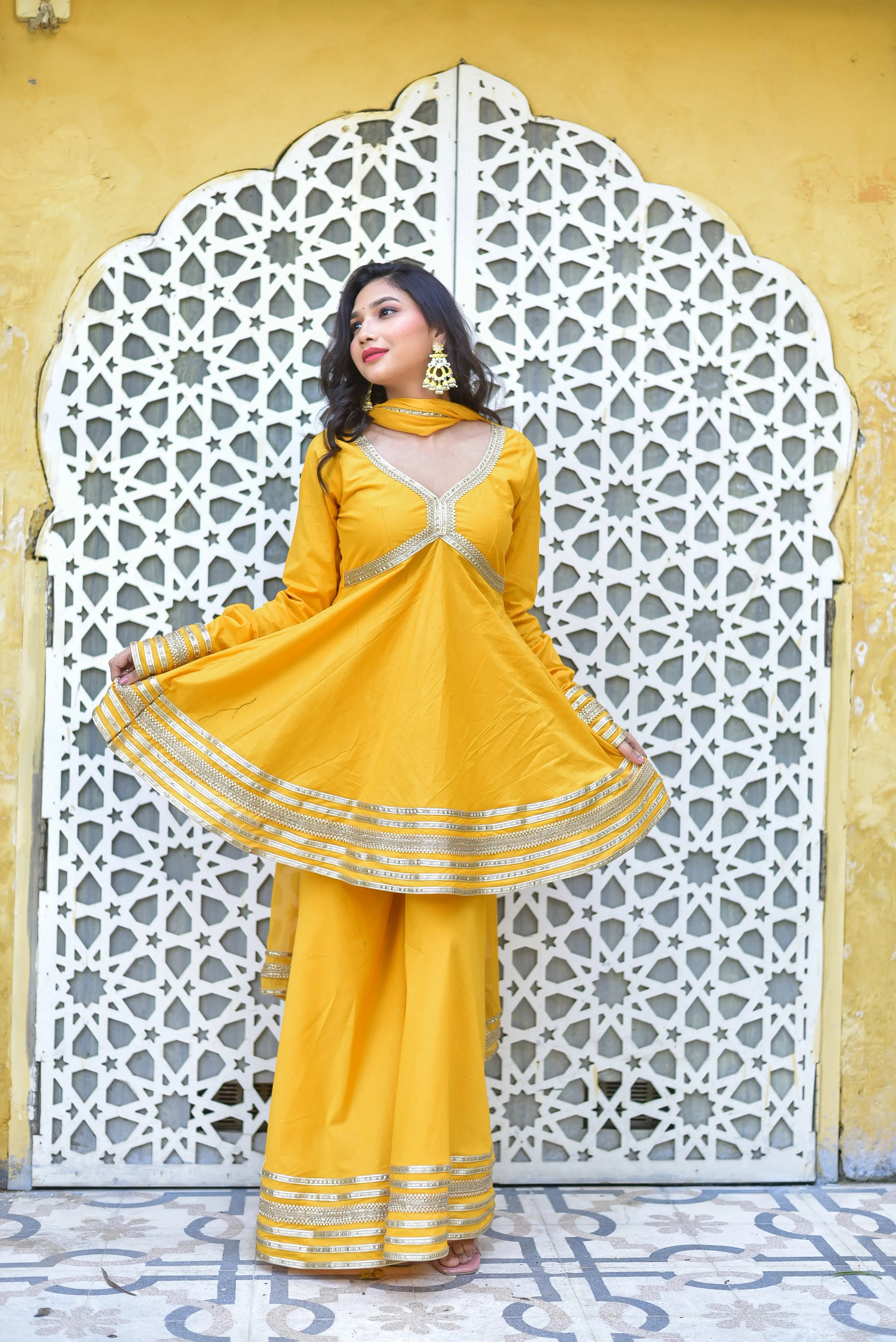 Radiant Mustard-Yellow Sharara Suit Set for Festive Elegance

Experience the epitome of festive fashion with this stunning mustard-yellow sharara suit set, designed to make a statement at any celebration. The rich, vibrant color exudes warmth and joy, while the intricate details and elegant design ensure you stand out with sophistication.

Key Features:

 Timeless Mustard-Yellow Hue: A classic choice for festive occasions, evoking feelings of joy, prosperity, and energy.