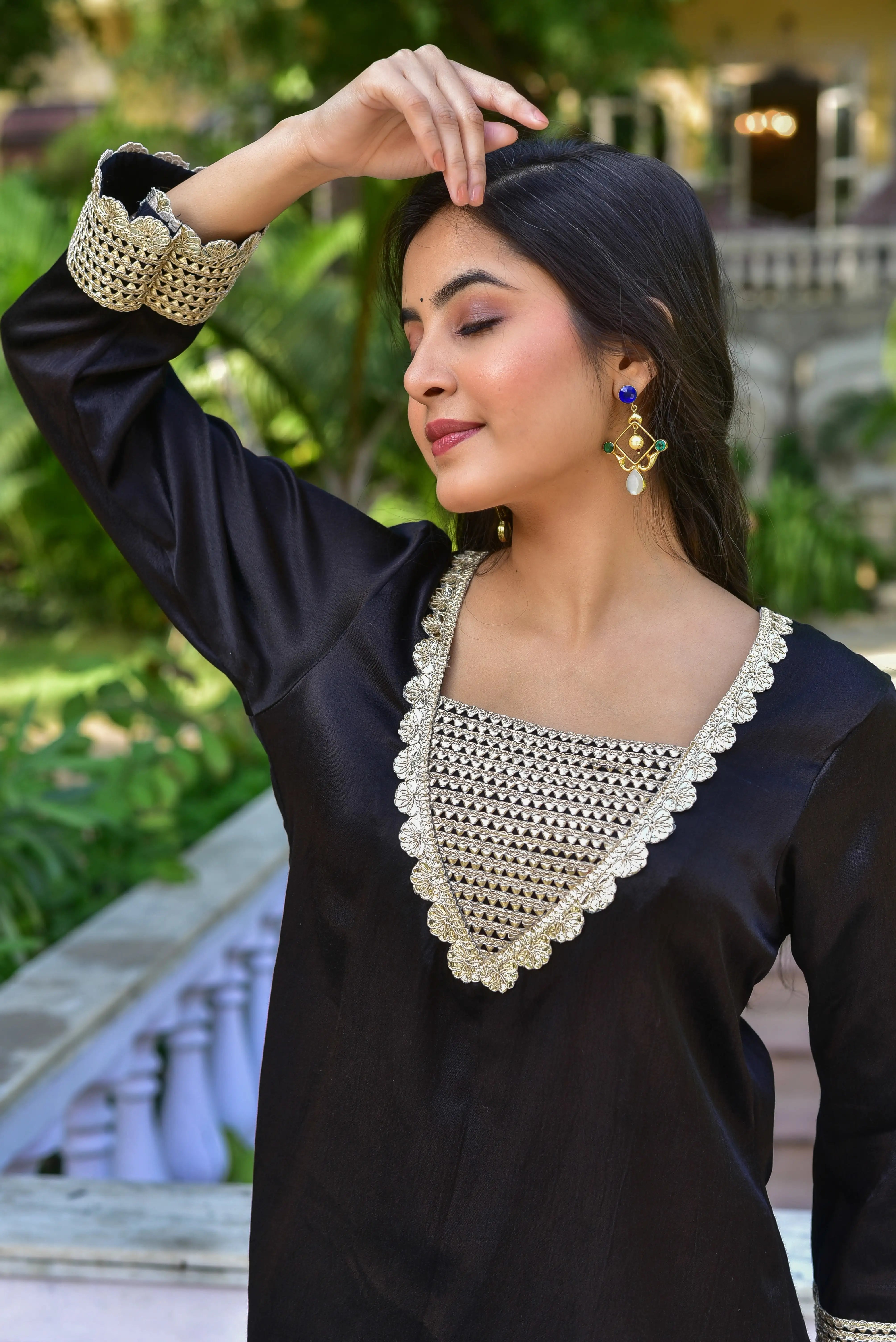 The Black Shadow Co-ord Set is a masterpiece of understated elegance, featuring a rich black fabric that exudes sophistication and refinement. This timeless ensemble boasts a classic silhouette with contemporary detailing, making it a perfect choice for those seeking to make a statement without overdoing it. The intricate design and luxurious fabric work together to create a look that is both stylish and versatile, suitable for various occasions from formal events to everyday wear.