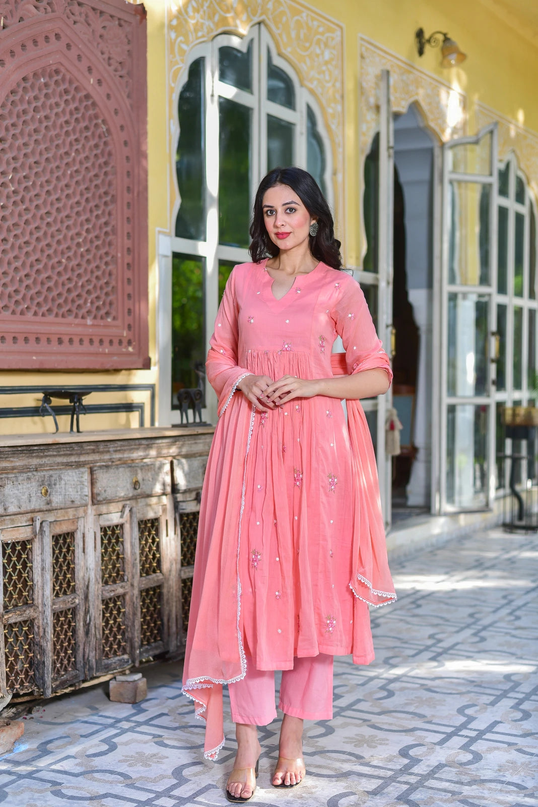 The Peach Petal Kurta Set - A Stunning 3-Piece Ensemble for Elegance and Comfort

This beautiful set features a gracefully flared kurta in a lovely peach hue, crafted from premium pure cotton fabric for all-day comfort. The kurta is adorned with delicate floral embroidery, adding a touch of sophistication to your outfit. The matching dupatta and palazzo pants complete the look, creating a cohesive and stylish ensemble.