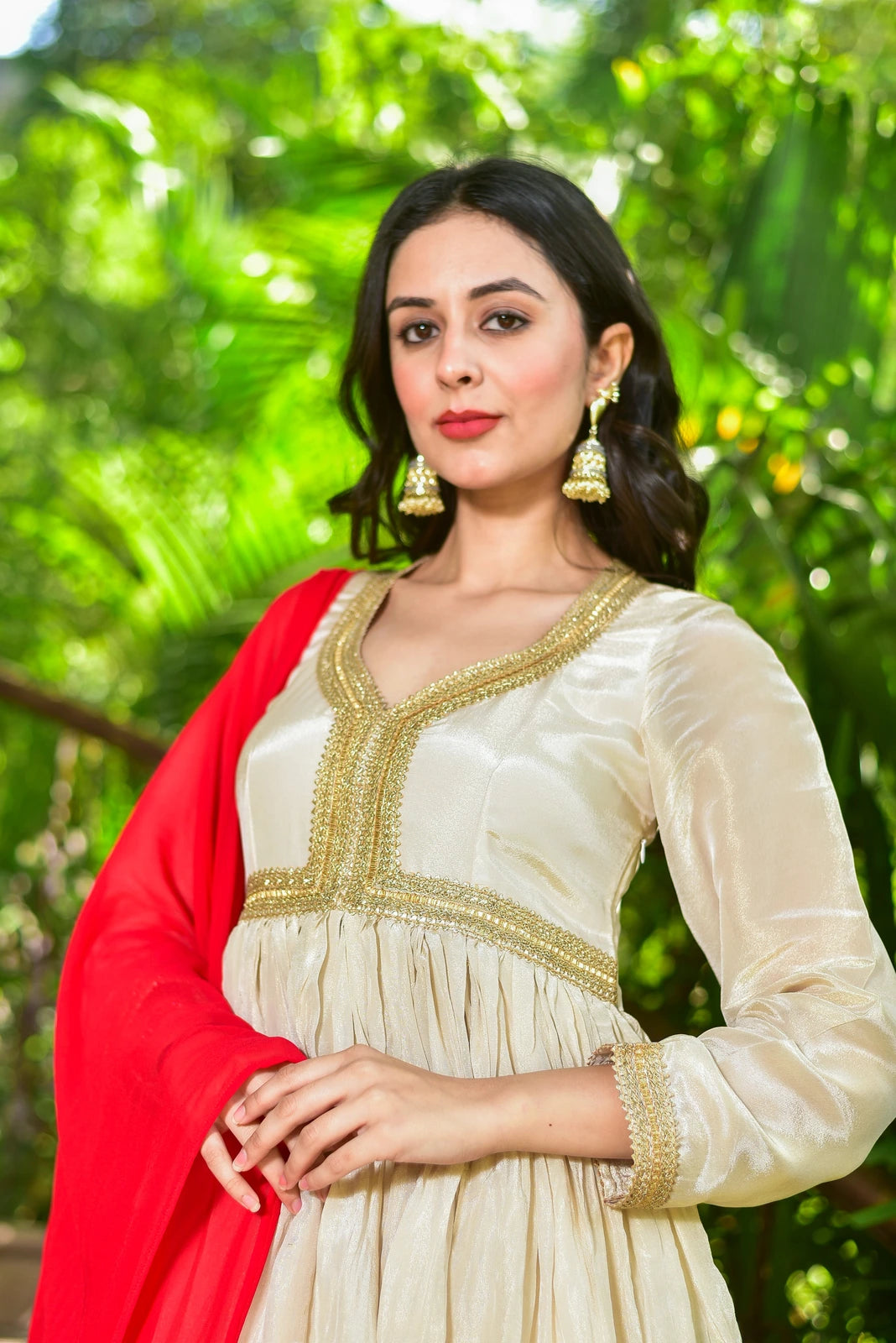 Experience the Epitome of Elegance with The Shahi Silk Anarkali Set

Discover the perfect blend of traditional charm and contemporary style with this exquisite 2-piece ensemble. Crafted from luxurious cream zari silk, the anarkali dress is adorned with intricate gold lace detailing that adds a touch of sophistication to any occasion.