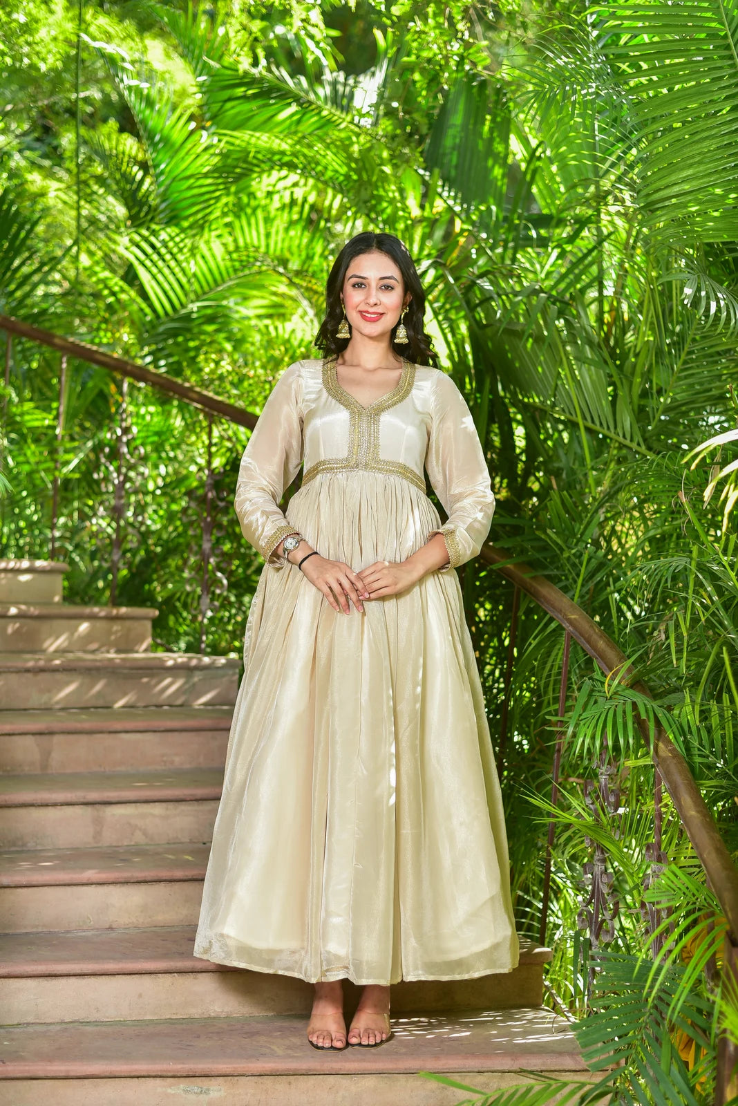 The Shahi Silk Anarkali Set is a stunning 2-piece ensemble that exudes timeless elegance and festive grandeur. Crafted from luxurious cream zari silk, this set features a flowing anarkali dress adorned with exquisite gold lace detailing, paired with a matching dupatta. Perfect for making a statement at any special occasion, this set is a must-have for anyone looking to add a touch of regal sophistication to their wardrobe.