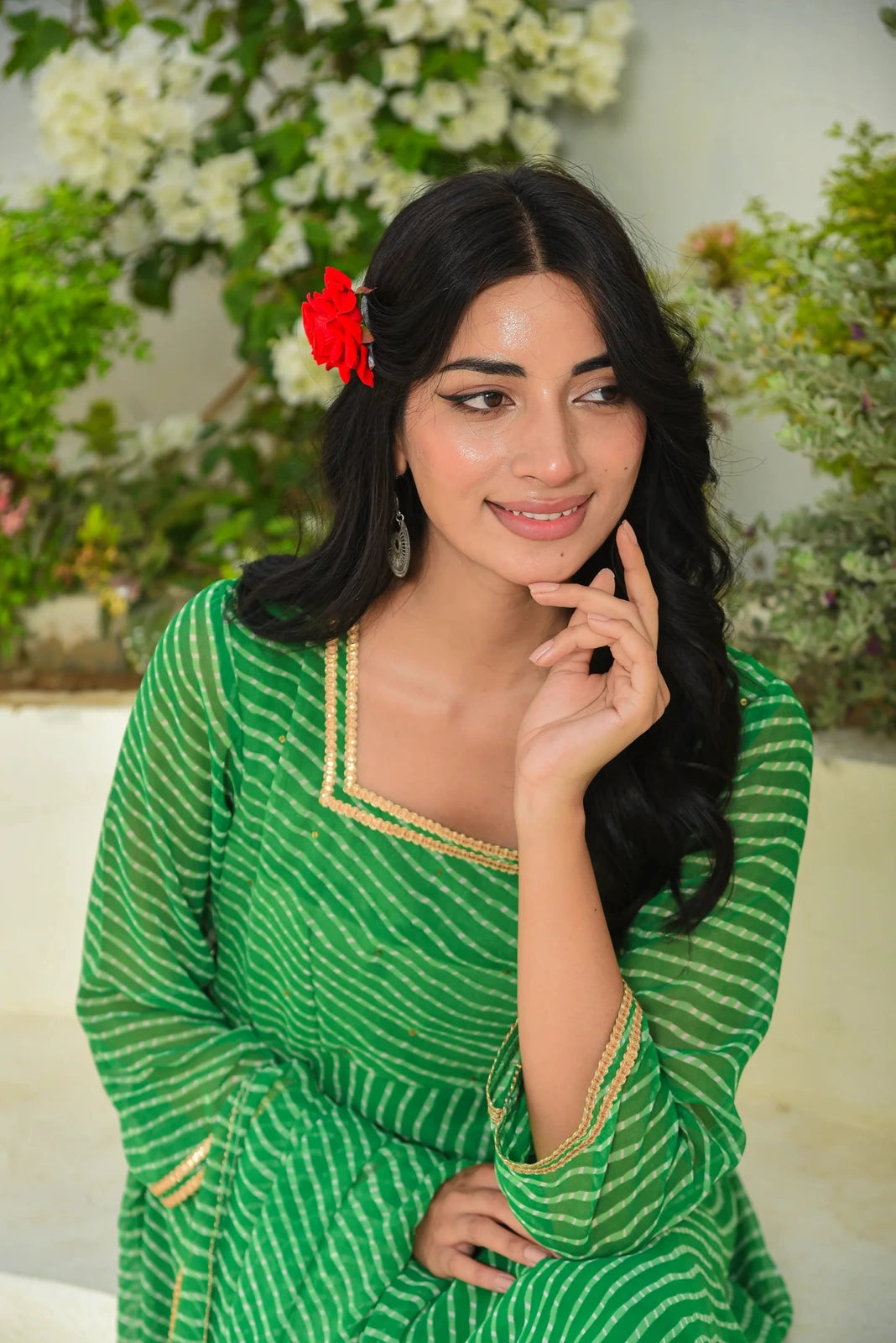 This elegant blue Mothada Umbrella Lehenga Set features a sweetheart neckline, 3/4 sleeves, and a Modhada print. The blouse has a hook placket closure, and the lehenga is finished with lace detailing. This stunning set is perfect for festive occasions and is sure to make a statement.