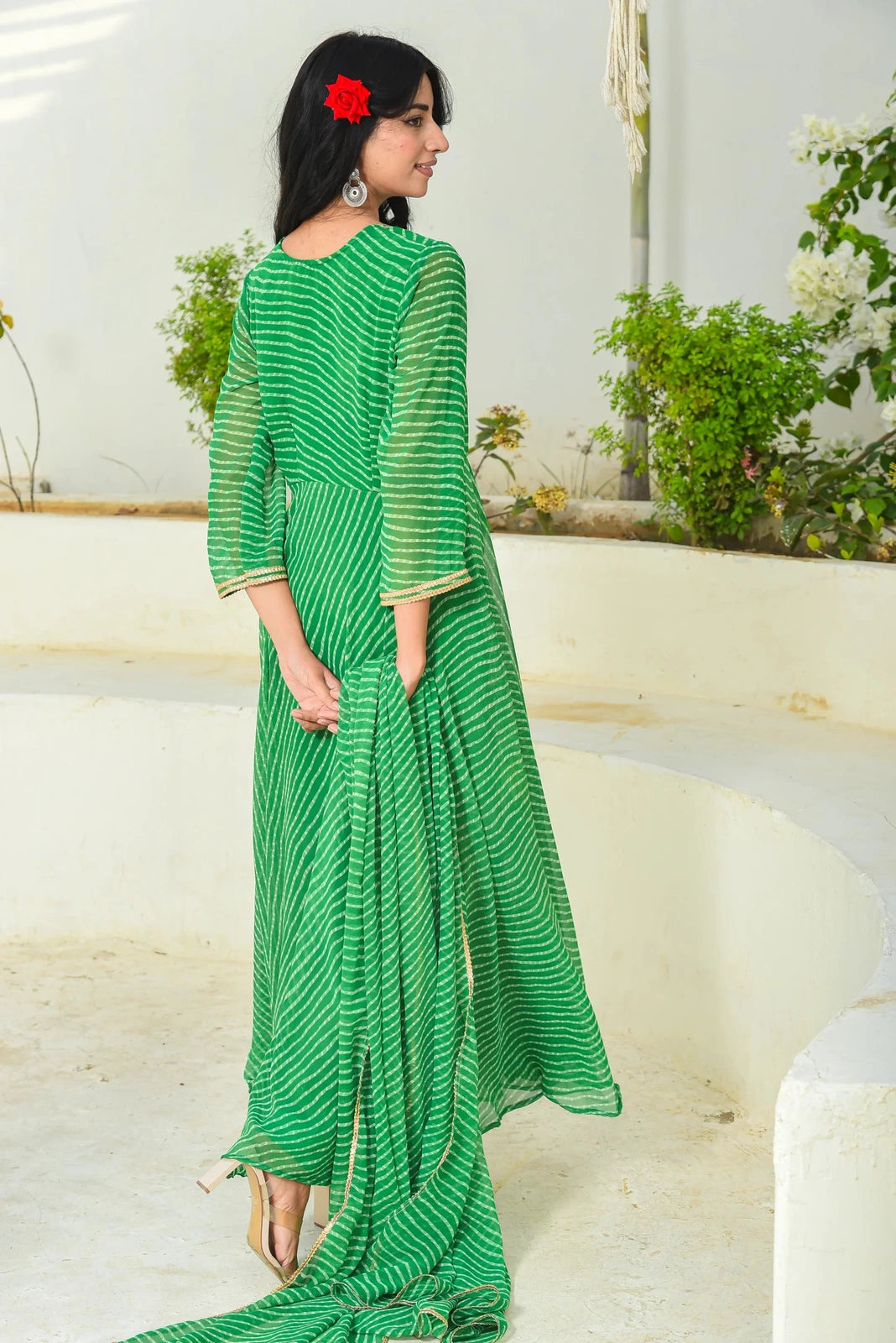 This stunning blue set, perfect for festive occasions, features a lehenga, blouse, and dupatta with a sweetheart neckline, 3/4 sleeves, and elegant Modhada print. The blouse boasts a hook placket closure, while the lehenga has a hook placket with zip. Finished with lace detailing, this ensemble is sure to turn heads. With its vibrant color and intricate design, it's an excellent choice for making a statement at any event.