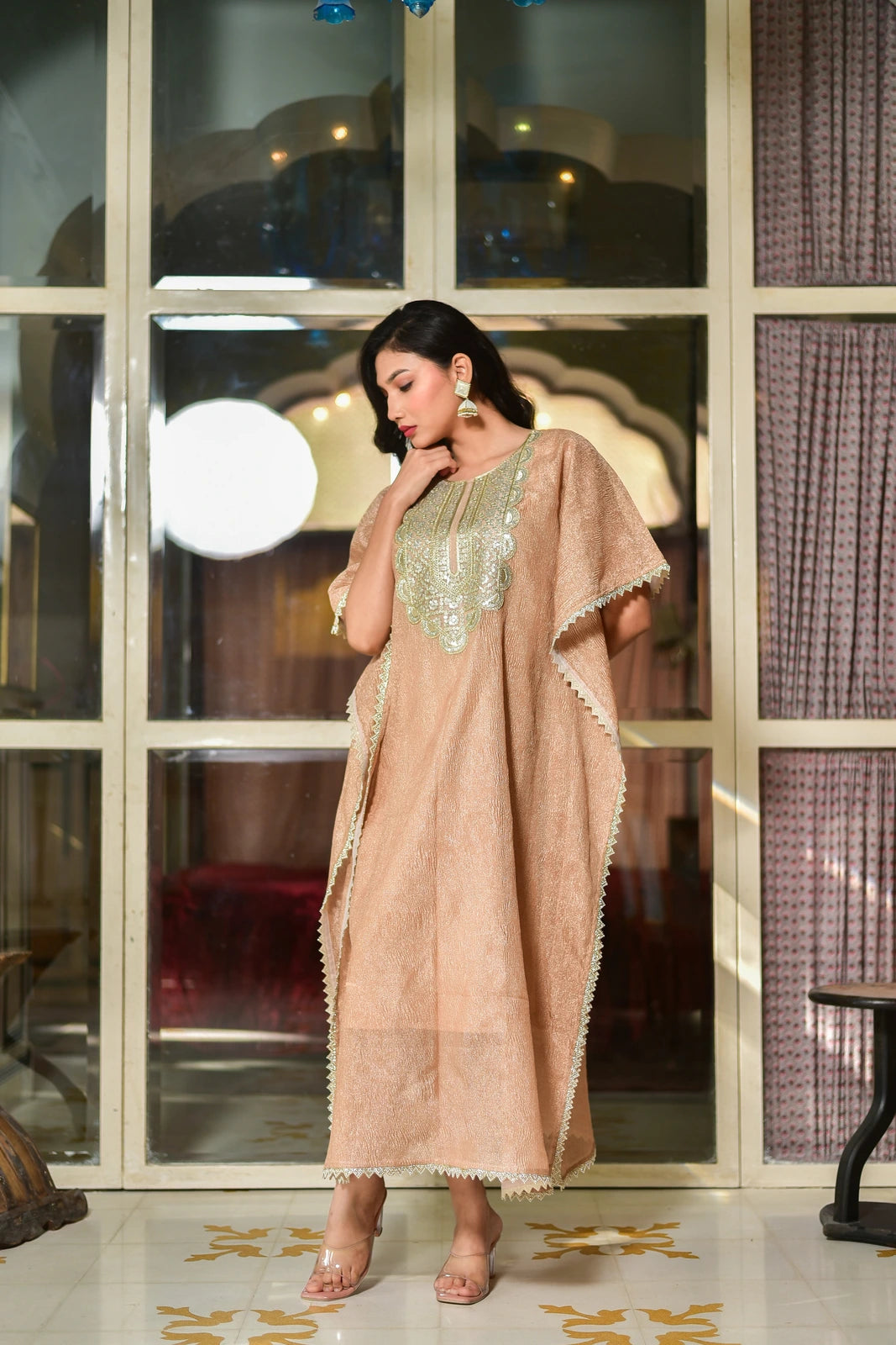 Effortless Elegance in Kaftan Form

This stunning kaftan dress is a masterpiece of contemporary luxury, crafted from premium moss organza that drapes beautifully while maintaining its graceful structure. The sophisticated lavender tone exudes regal charm, making this piece a statement for your special occasions.

Elegant Design

The kaftan features a luxurious lavender hue, complemented by intricate embroidery that adds a touch of sophistication.