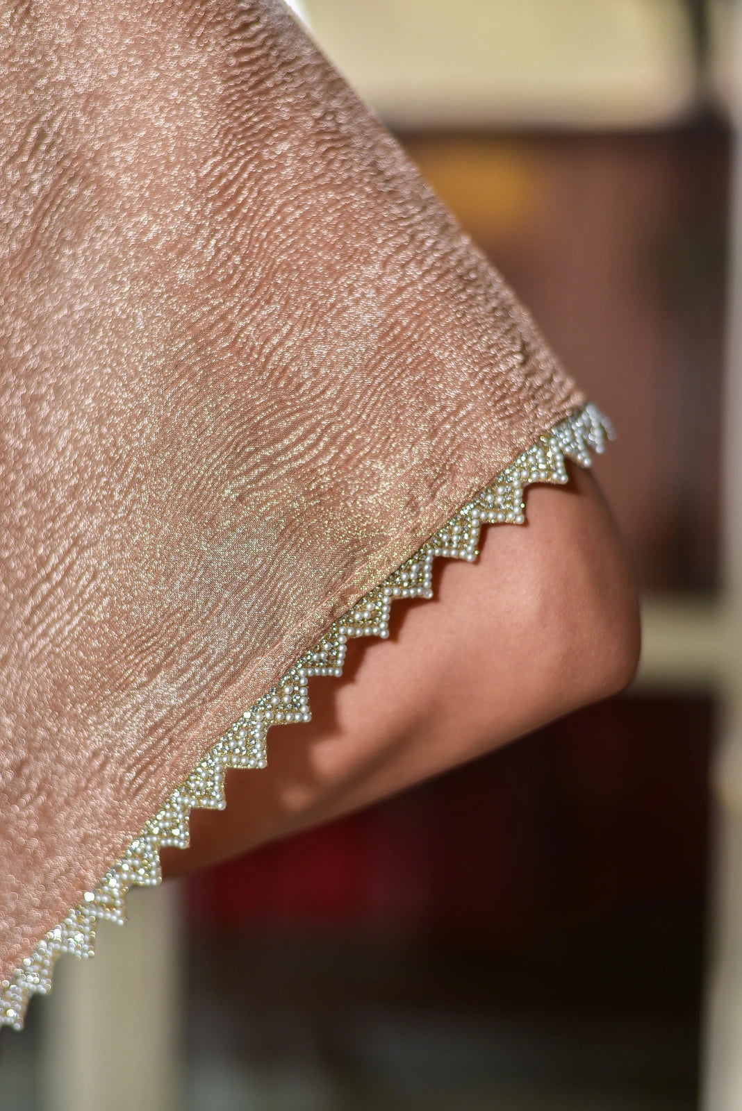 This exquisite blush gold kaftan dress is a testament to contemporary luxury, crafted from premium moss organza that drapes elegantly while maintaining its structured form. The sophisticated lavender tone exudes regal charm, making this piece a statement for your special occasions. The luxurious fabric and refined color palette come together to create a truly eye-catching ensemble that is sure to turn heads.