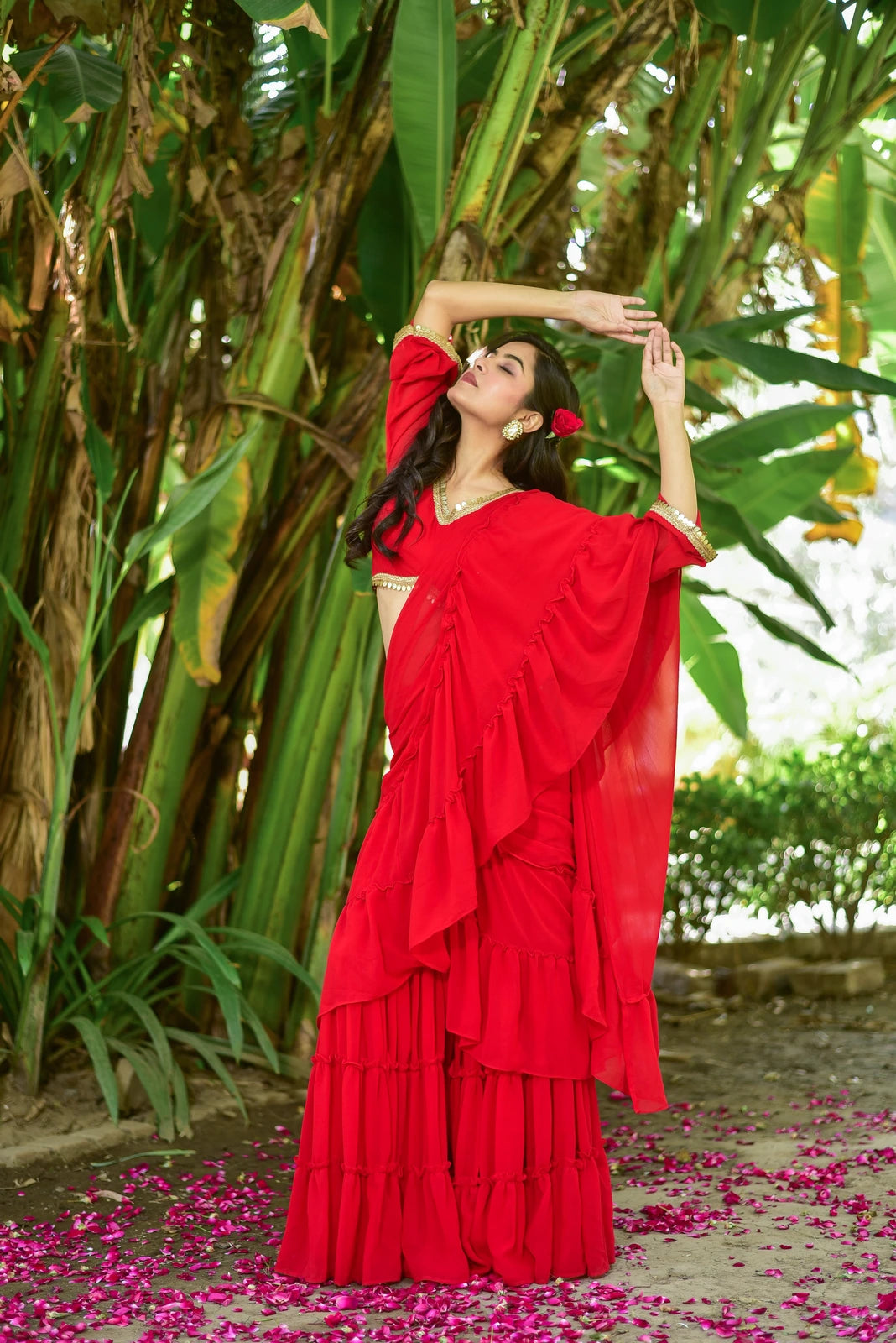 The Regal Red Georgette Sharara Saree Set is a stunning fusion of traditional grace and contemporary design, perfect for weddings, festive celebrations, and special occasions. This exquisite ensemble features a vibrant red georgette fabric, a flowing sharara style, and intricate embroidery that adds a touch of elegance to any outfit. The set includes a matching blouse and dupatta, making it a complete and stylish look for any occasion.