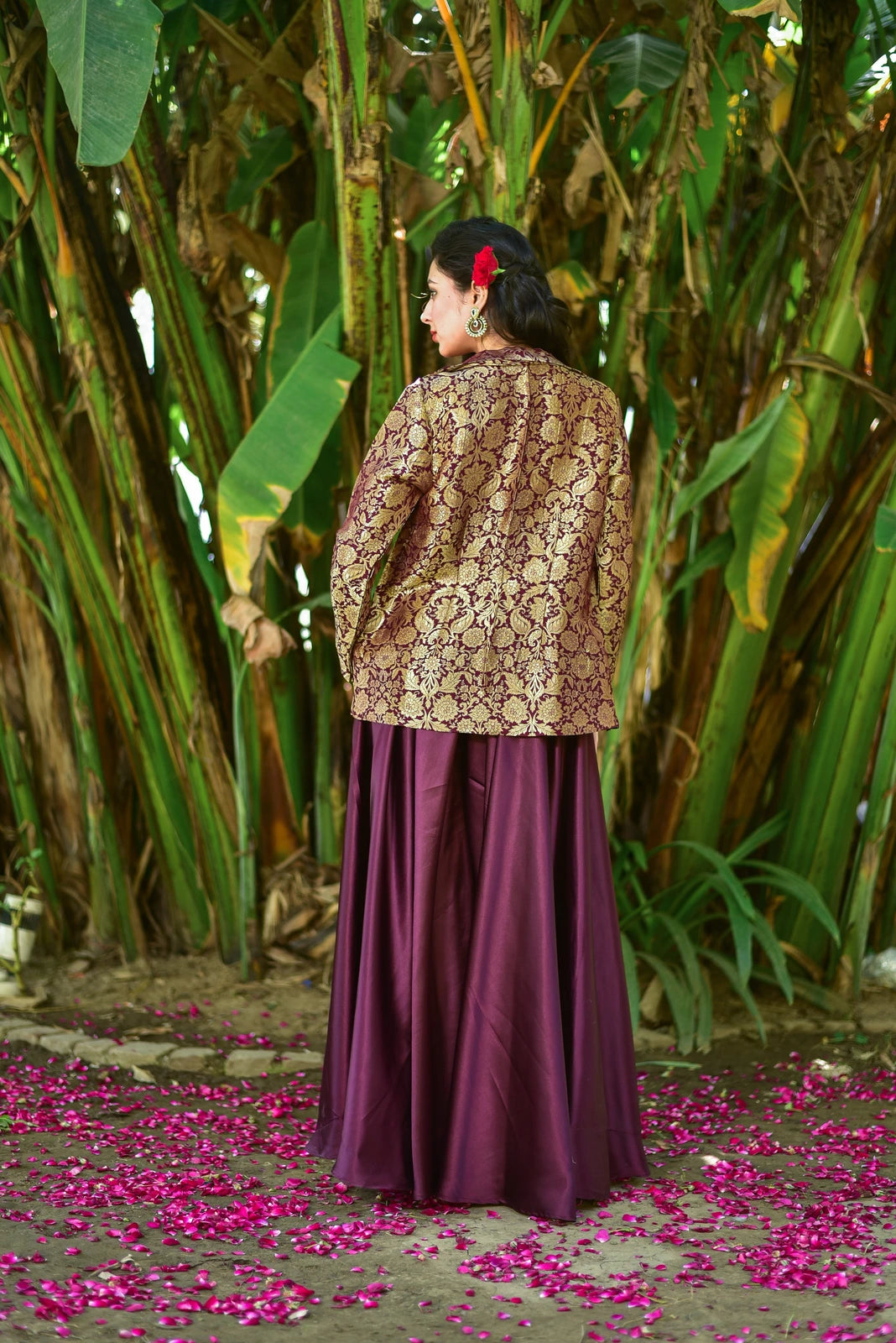 The Plum Magic Brocade 3 Piece Set is a stunning ensemble that embodies the perfect blend of contemporary elegance and traditional opulence. The set includes a brocade blazer, a skirt, and a top, each crafted from high-quality fabrics that exude sophistication and style.