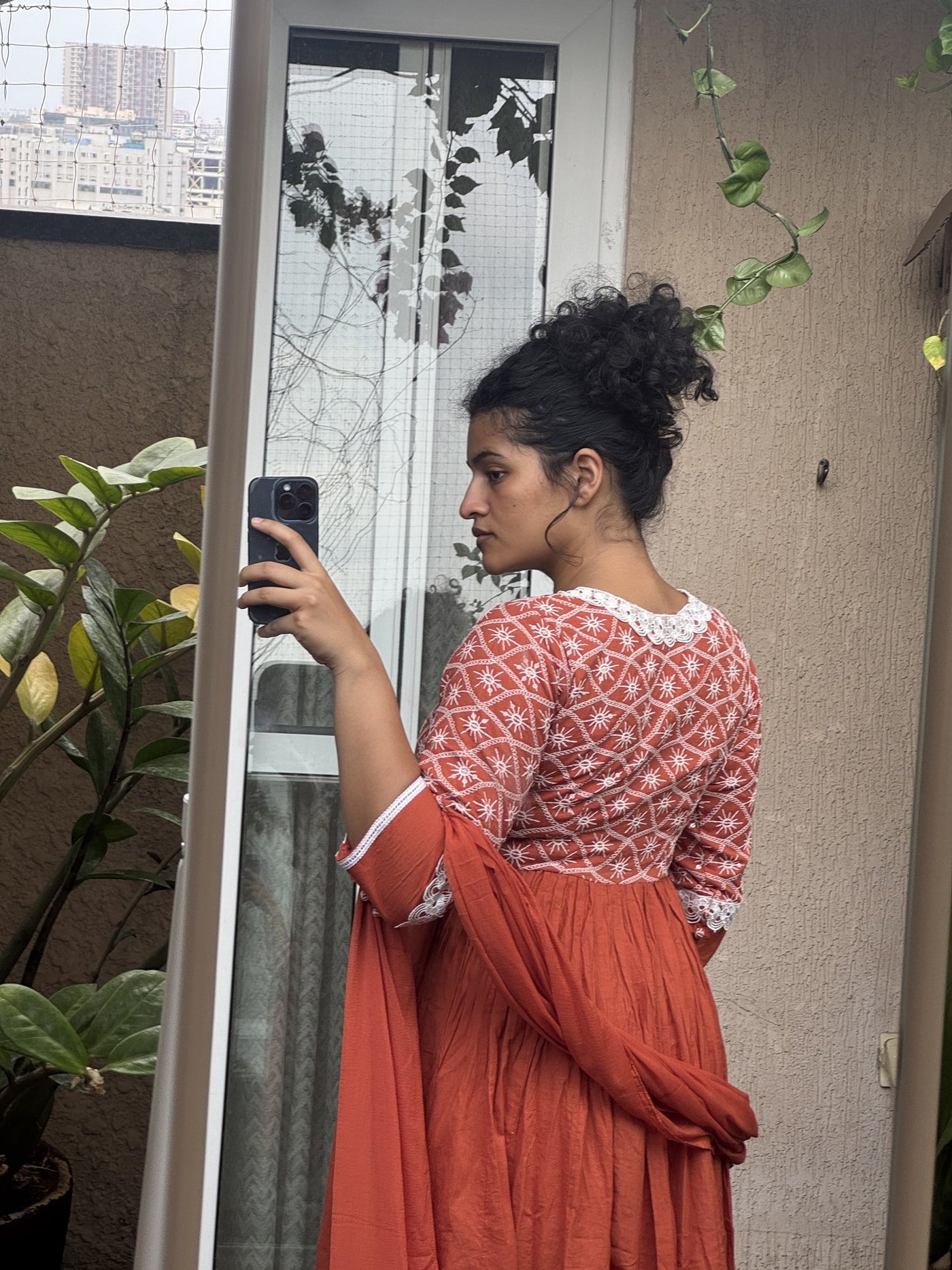 Saroj Jain Terracotta Rust Red Lucknowi Chikankari Anarkali Gown full silhouette with matching dupatta and pants.